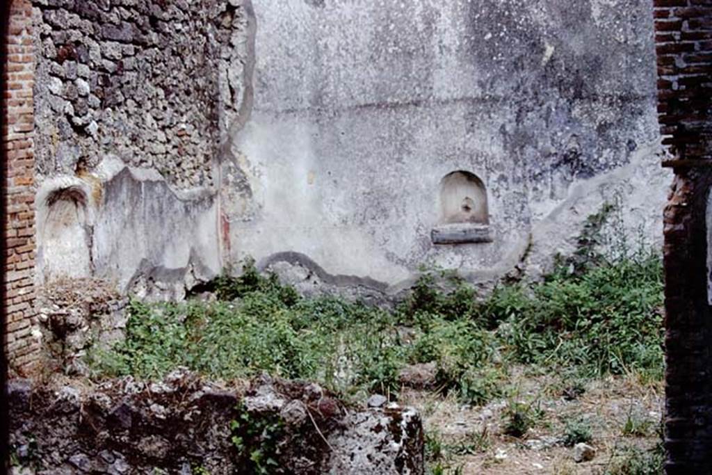 VI.14.30 Pompeii. 1972. Looking towards south-east corner of garden area.
The remains of the aedicula lararium can be seen against the east wall, on the left, and the niche against the south wall, centre right.
According to PPM, the garden wall decoration is now completely lost but was accurately described by Mau.
See Mau, in Bullettino dell’Instituto di Corrispondenza Archeologica (DAIR), 1876, pp.53-54.
See Carratelli, G. P., 1990-2003. Pompei: Pitture e Mosaici. Vol. V. Roma: Istituto della enciclopedia italiana. (p.358, nos.24-25)
Photo by Stanley A. Jashemski.
Source: The Wilhelmina and Stanley A. Jashemski archive in the University of Maryland Library, Special Collections (See collection page) and made available under the Creative Commons Attribution-Non-Commercial License v.4. See Licence and use details.
J72f0410