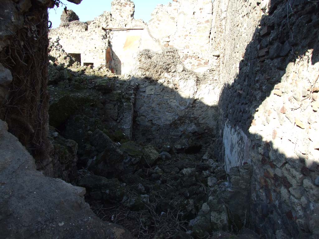 VI.14.38 Pompeii. December 2007. Looking north to rooms at rear (east) of peristyle, in background.
VI.14.39 is in foreground looking north into rear rooms. Taken from VI.14.22.