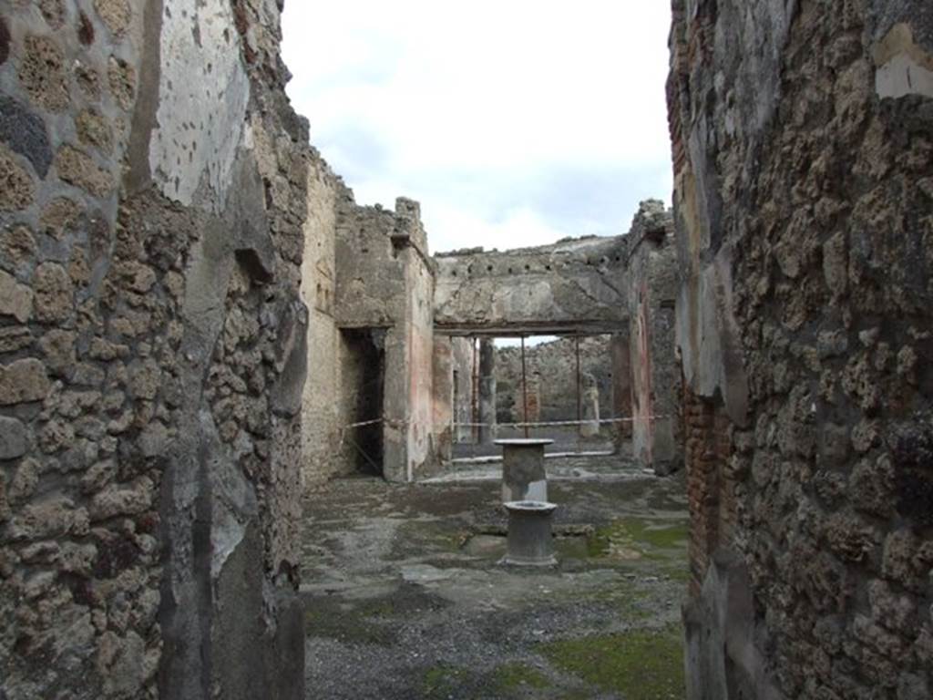 VI.14.40 Pompeii. December 2007. Peristyle on east side of tablinum.
According to Jashemski, the peristyle garden at the rear of the tablinum, was visible from the entrance doorway. It was enclosed on most of the north and part of the south sides by narrow passageways. On the west side by a wide portico supported by two stuccoed columns, yellow to a height of I.86m, red above. The side passages were covered by overhanging roofs from the adjacent rooms. The triclinium on the left had a large window looking into the garden. On the right of the garden, a statuette of a small boy holding a little dog, was found. The front legs of the dog were missing, as were also the legs of the boy from the knees down. A rectangular base with a portion of the feet was found.
Now in Naples Archaeological Museum, inventory number 120511.
See Jashemski, W. F., 1993. The Gardens of Pompeii, Volume II: Appendices. New York: Caratzas. (p.151)