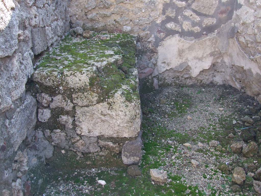 VI.14.43 Pompeii. December 2007. Room 10, stone bench in south-east corner of kitchen room.
According to Boyce, there was an arched niche in the west wall opposite a masonry structure.
This was in the small kitchen-like room on the south side of the atrium.
See Boyce G. K., 1937. Corpus of the Lararia of Pompeii. Rome: MAAR 14. (p.54, no.210)
See Giacobello, F., 2008. Larari Pompeiani: Iconografia e culto dei Lari in ambito domestico. Milano: LED Edizioni. (p.180)