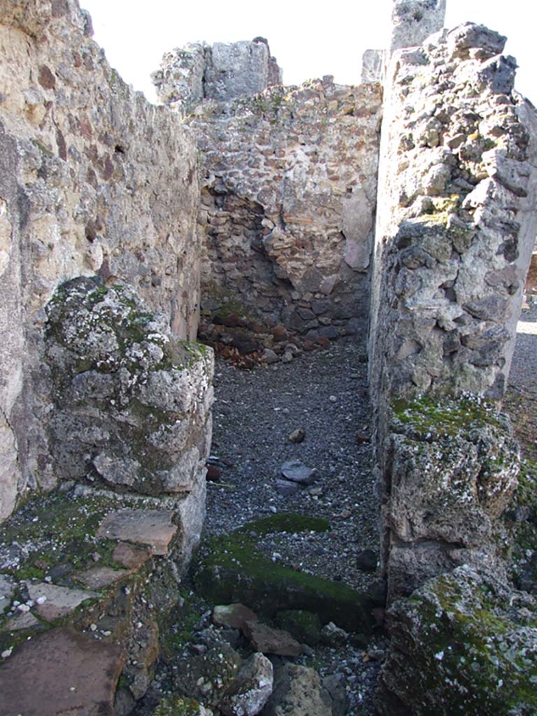 VI.14.43 Pompeii. December 2007. Looking west into room 13 from bench at room 12, on west portico.