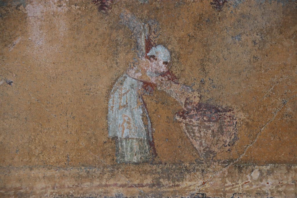 VI.15.1 Pompeii. October 2023.
North wall of atrium, detail from west end of lower yellow panel above site of strongbox. Photo courtesy of Klaus Heese.