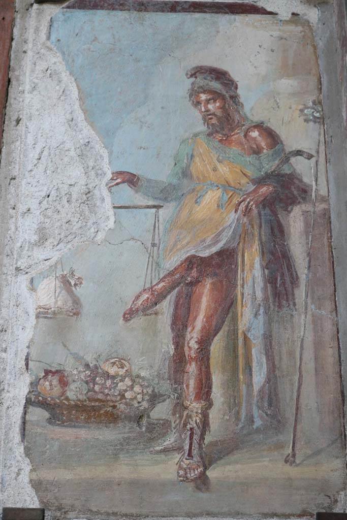 VI.15.1 Pompeii. December 2018.
Painting of a bearded Priapus from vestibule. Photo courtesy of Aude Durand.
