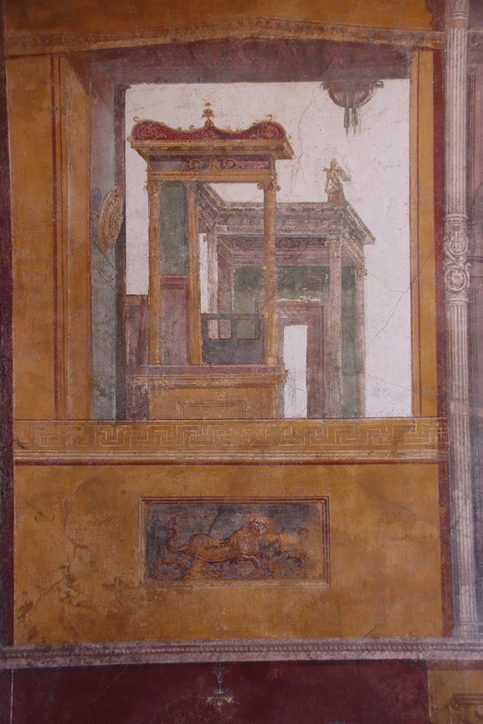 VI.15.1 Pompeii. October 2024.
Architectural wall painting on south wall at east end in south-east corner of exedra.
Photo courtesy of Klaus Heese.
