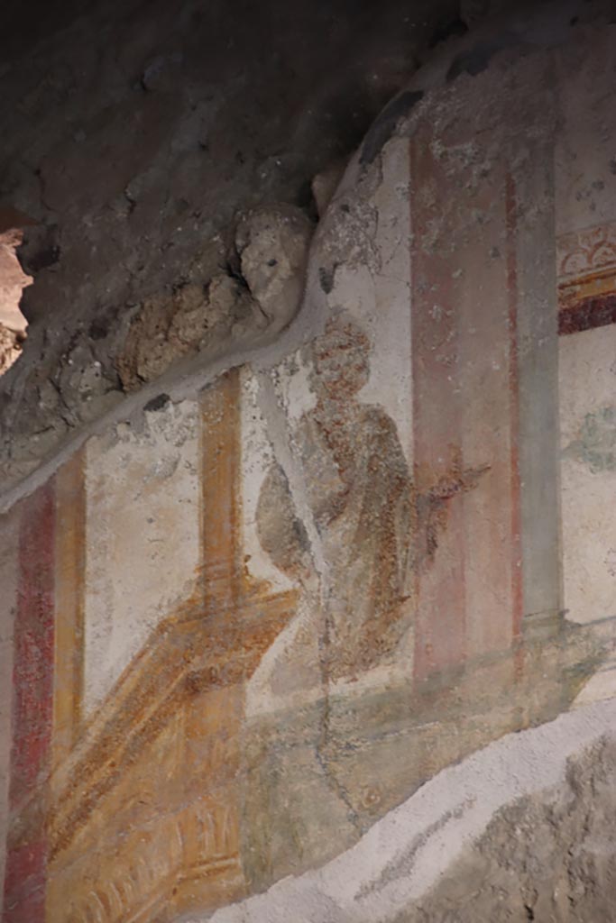 VI.15.1 Pompeii. October 2023.
Detail of painted figure from upper south wall in south-west corner. Photo courtesy of Klaus Heese.