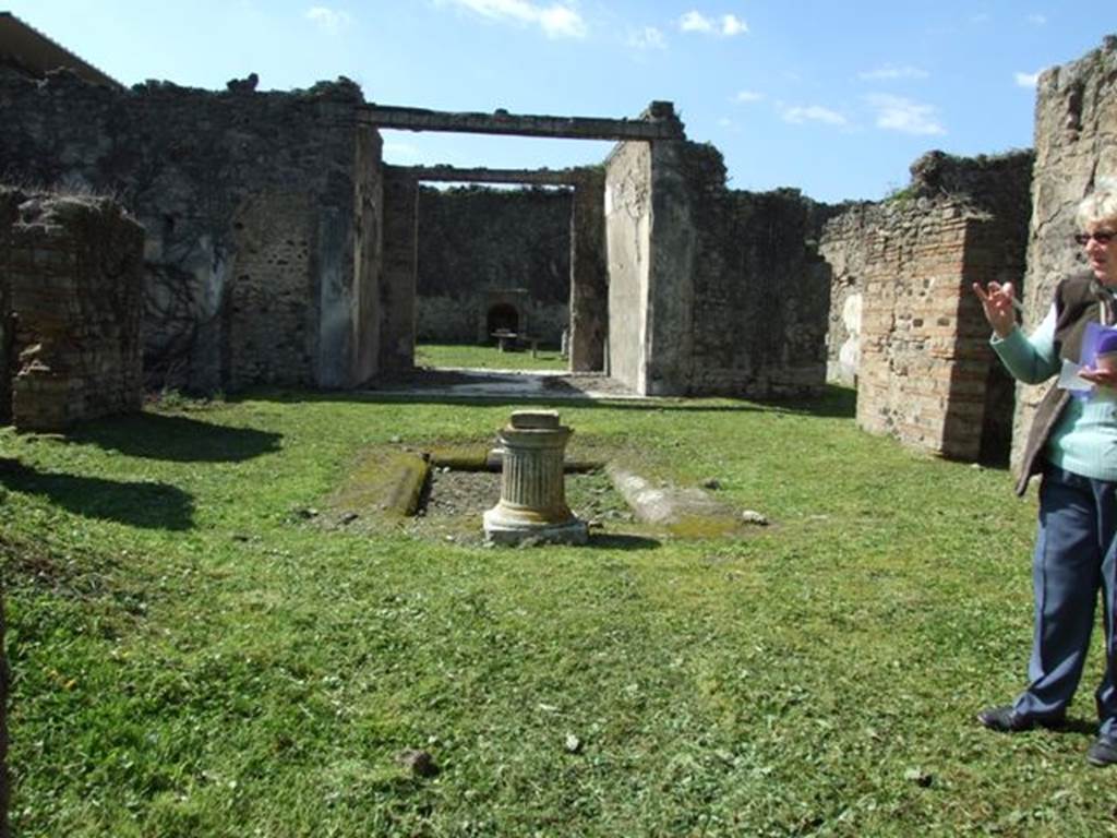 VI.15.5 Pompeii. March 2009. Room 1, looking west across atrium. According to NdS, the tuscan atrium was spacious, with an impluvium of tufo in the middle. The flooring was littered with small pieces of coloured marble. The walls were devoid of any decoration and that this house was undergoing restoration was demonstrated by the building materials found here and there. Found in the atrium were two bronze seals, one with the name Titiniae Saturni, and Sogliano could read L. Sepun(i) Symphron(is) on the other. Another bronze seal was found in a cubiculum on the north side of the atrium, it read - C. Stlacci Epitynchan(i)
See Notizie degli Scavi, January 1897, (p.22)