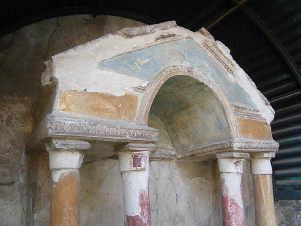 VI.15.8 Pompeii. May 2012. Painted columns and pediment on household shrine in the garden. Photo courtesy of Buzz Ferebee.