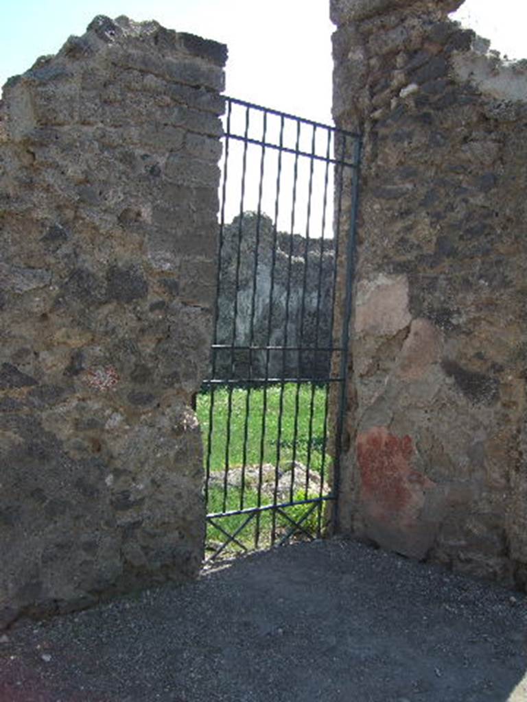 VI.16.4 Pompeii. May 2005. Entrance doorway, looking south-west.
According to Cooley, found on the wall between VI.16.4 and 5 was the graffito, which translated as  –
May god always make Felix Aufidius felicitous.    [CIL IV 6815]
See Cooley, A. and M.G.L., 2004. Pompeii : A Sourcebook. London : Routledge. (p.90)
According to Epigraphik-Datenbank Clauss/Slaby (See www.manfredclauss.de) this read -
Felicem Aufidium felicem semper deus faciat       [CIL IV 6815]

