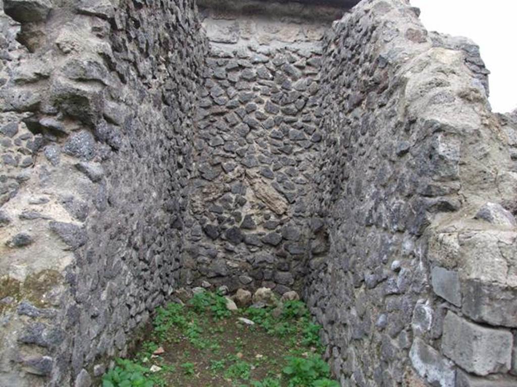 VI.16.8 Pompeii. December 2007. Looking west towards site of staircase to upper floor.
According to NdS, the small entrance room contained the first section of the staircase with five masonry steps. At the top of the masonry steps was a staircase landing in wood supported by the beams.  Above the landing, wooden stairs continued to the upper floor.
At the foot of the stairs was the circular mouth of a terracotta cistern. Found under the landing was a deposit of amphorae. See Notizie degli Scavi di Antichit�, 1908, (p.54)
