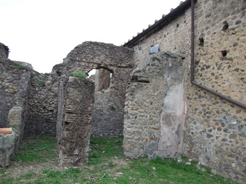 VI.16.13 Pompeii. December 2007. Doorways to rooms in north-west corner. According to NdS, on the northern wall of the workshop was a trace of the wooden staircase that led to the upper floor. This was accessed from VI.16.14. See Notizie degli Scavi di Antichit�, 1908, (p.62).