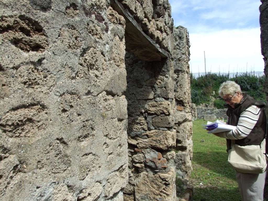 VI.16.27 Pompeii. March 2009. Looking east along corridor leading to peristyle.  North wall, with doorways to rooms U and stairs (V�) to upper floor.


