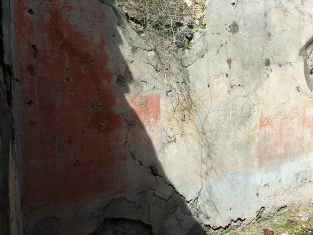 VI.16.28 Pompeii. March 2009. Room H, north wall. According to NdS, the decoration on this wall was the best preserved. The principle space was occupied by three major panels, yellow in the centre, with red on either side. There was no central painting exhibited in the middle. The frieze rather faded carried also panels of various colours, and the dado had a blackish background. In the height of the north wall was a bull�s eye partly walled by the ancients. See Notizie degli Scavi di Antichit�, 1908, (p.278-9)

