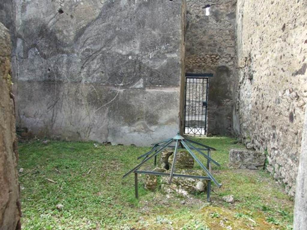 VI.16.29 Pompeii. March 2009. Room O, looking west across to fauces P of entrance VI.16.30. According to NdS, room O was quite spacious and had a rough cocciopesto floor and bare walls, with the usual brick plinth. On the north wall was the base  stone of a wooden staircase. In the north-east corner was the cistern mouth. On the extreme right of the west wall was painted on the plinth, from the right to the left, a serpent agatodemone, which approached towards an altar through plants. Found in the soil of this house on the 29th August 1904, but without a precise indication of place, was the upper part of an altar of red marble (m.0.08 x 0.065). See Notizie degli Scavi di Antichit�, 1908, (p.284). According to Boyce, in the room entered from the posticum of VI.16.30 was a lararium. It was on the white ground of the dado of the west wall. A single yellow serpent was painted, advancing to the left towards an altar furnished with offerings. In the background were plants. See Notizie degli Scavi di Antichit�, 1908, (p.284). See Boyce G. K., 1937. Corpus of the Lararia of Pompeii. Rome: MAAR 14. (p. 59, no 227).
.