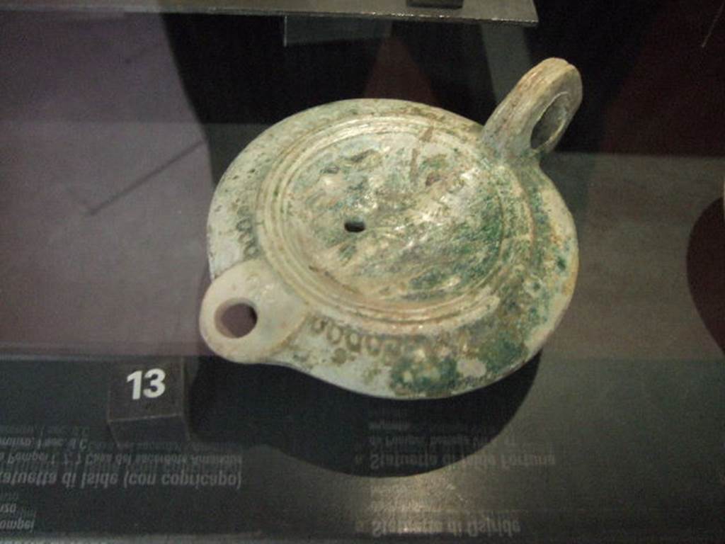 Terracotta lamp with images of Isis, Harpocrates and Anubis. Found in VI.16.40. Now in Naples Archaeological Museum.