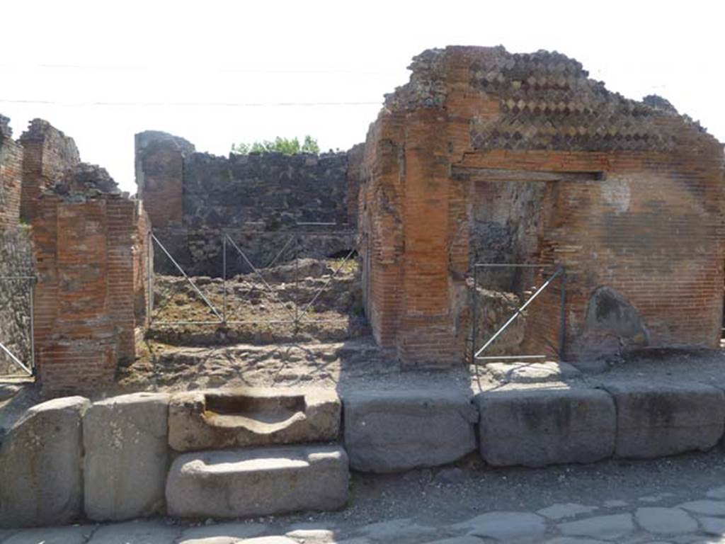VI.17.36-35 Pompeii. May 2011. Looking west to entrance doorways on Via Consolare.
Photo courtesy of Michael Binns.