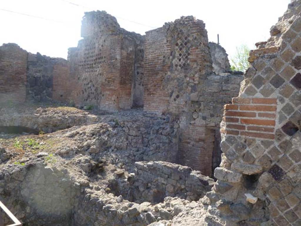 VI.17.36 Pompeii. May 2011. North side, with both upper and lower levels. Photo courtesy of Michael Binns. Possibly the upper level on the right of this photo may have been the area as described in PAH, 1, 3, (p.4) “1-18th Maggio 1808 – Il giorno 15 del corrente venne il Re a Pompei, ed in sua presenza si scavarono due stanze e due botteghe appartenenti alla casa di Polibio. In una di queste stanze la fabbrica era alquanto diroccata, ed il pavimento in musaico bianco e nero, con un quadro nel mezzo di musaico colorito rappresentante la figura di Atteone; detto quadro era di circa palmi due in quadro. Nell’altre stanze le pareti sono tutte dipinte con varii arabeschi, e vi sono due quadri, uno con figura di uomo sedente con puttino, l’altro con due figure sedenti una di uomo a l’altra di donna con puttino. Detti quadri sono di palmi 1 and three-quarters in quadro. In questa stanza e nelle due botteghe si era trovato quanto segue –”
(translation – "1-18th May 1808 – On the 15th day of the current month the King came to Pompeii, and in his presence they dug two rooms and two shops belonging to the House of Polybius. In one of these rooms the structure was somewhat dilapidated, and the floor in black and white mosaic, with a picture in the middle of colorful mosaic representing the figure of Actaeon; this picture was approximately 0.53m square). In the other rooms the walls were all painted with various arabesques, and there were two paintings, one with a figure of a sitting man with a small cherub, (NAP inv. no: 9382, Helbig 1357), the other with two sitting figures, a man and a woman, with a small cherub. These paintings are approximately 0.46m square. In this room and in the two shops, the following were found, (see list p.4-6) –”
“28 Maggio 1808 – Nella casa detta di Polibio a Pompei si sono terminate di ricercare, la stanza che resta alla destra dell’ingresso, e le due botteghe della stessa abitazions, che s’incominciarono a frugare il di 15 di questo mese………………... Quello che si trovo……..., e quell’altro poco che in seguito si era rinvenuto, era il seguente – Argento……(p4-6 elenco). (translation: “28th May 1808 – In the house called of Polybius in Pompeii, they had finished searching, the room that is to the right of the entrance, and the two shops in the same dwelling, which they had begun to search on the 15th of this month………………. The items found, ………… and those others found later, were as follows – Silver............ (p4-6 list)”