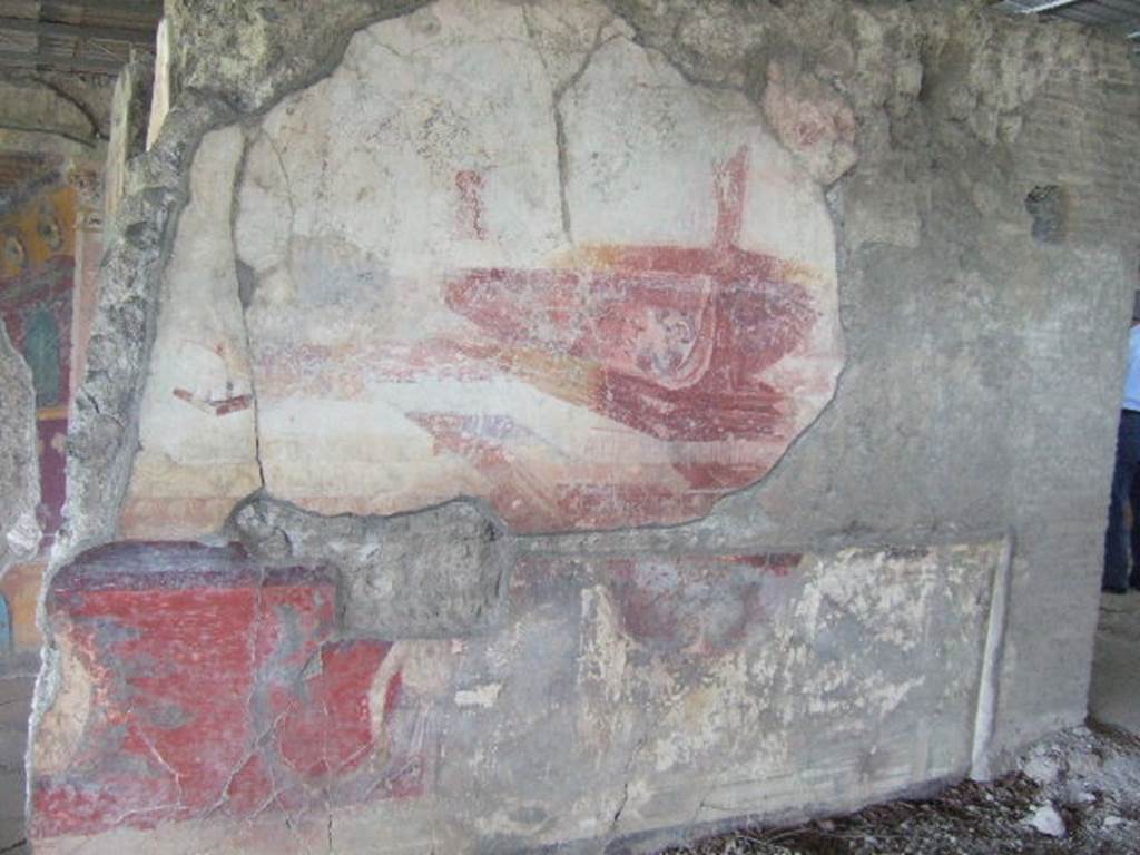 VI.17.41 Pompeii. May 2006. North wall of tablinum with remains of painting of a ship or ships. According to Eleanor Winsor Leach  �above a dado supported by telamones stand the prows of two large ships, each resting on its own rectangular pedestal base�.
See Winsor Leach, E., 2004.  The Social Life of Painting in Ancient Rome and on the Bay of Naples. Cambridge UK: Cambridge UP. (p.69 onwards)
