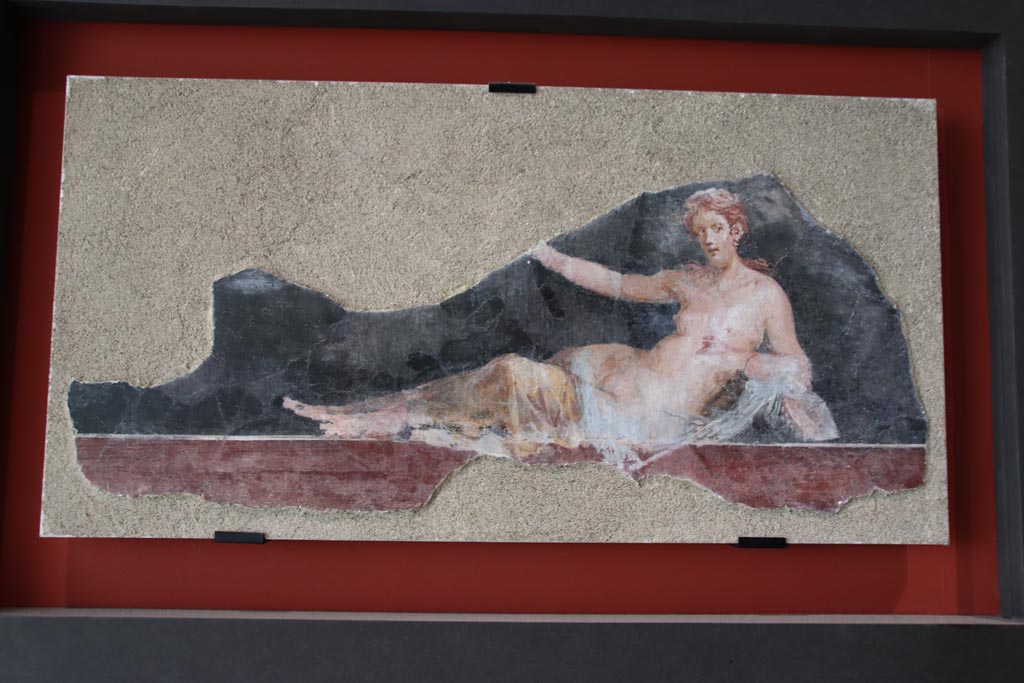 VI.17.42 Pompeii, October 2022.
Painting of a half-naked Maenad lying down, on display in exhibition in Palaestra. Photo courtesy of Klaus Heese.