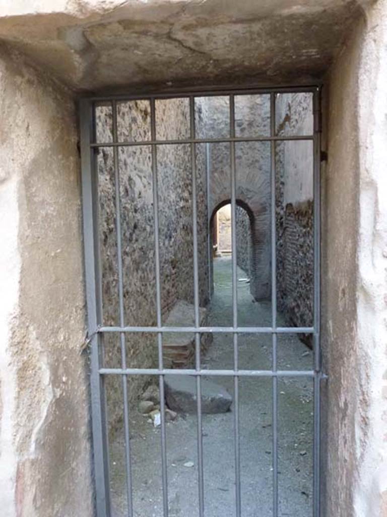 VII.1.14 looking towards VII.1.15 through gated doorway. June 2012. Photo courtesy of Michael Binns.