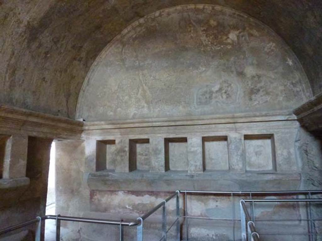 VII.1.8 Pompeii. June 2012. East wall of women�s changing room 11. The doorway to corridor 12 leading to entrance at VII.1.17 is on the left. Photo courtesy of Michael Binns.