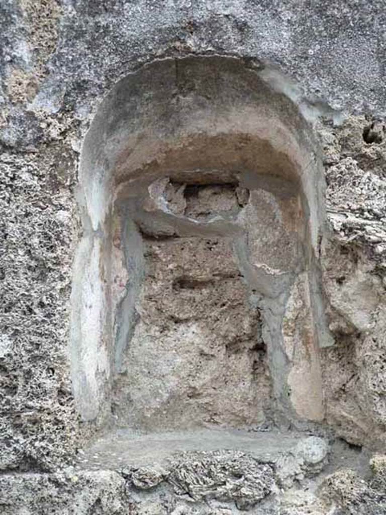 VII.1.42 Pompeii. May 2010. Niche, with remains of painting.
According to Frohlich, on the left was a Lar, in the middle was a round altar, and many figures in a group, possibly the vicomagistri.
See Fr�hlich, T., 1991. Lararien und Fassadenbilder in den Vesuvst�dten. Mainz: von Zabern. (F44, p.324)
See Pappalardo, U., 2001. La Descrizione di Pompei per Giuseppe Fiorelli (1875). Napoli: Massa Editore. (p. 78)
