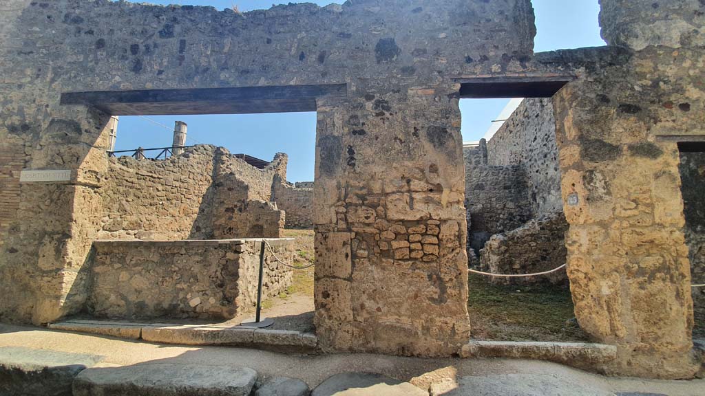 VII.1.44, on left, and VII.1.45, on right, Pompeii. July 2021. 
Looking towards entrance doorways on east side of Vicolo del Lupanare.
Foto Annette Haug, ERC Grant 681269 D�COR.
