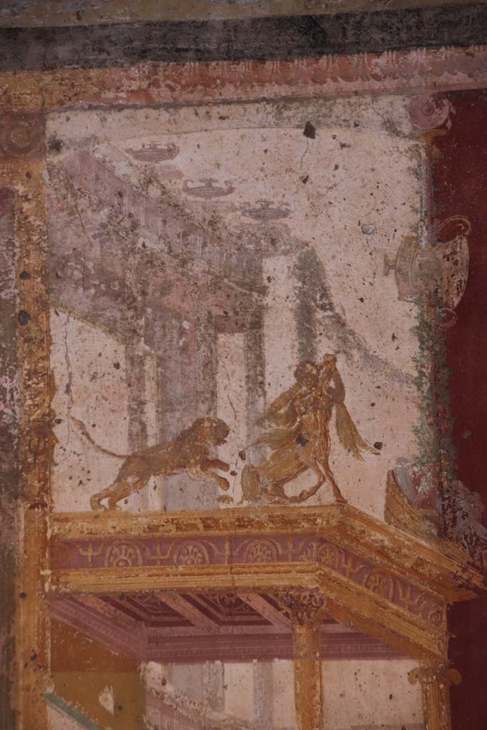 VII.1.47 Pompeii. September 2021.
Exedra 10, detail of painted centaur with lion, from east end of north wall. Photo courtesy of Klaus Heese.