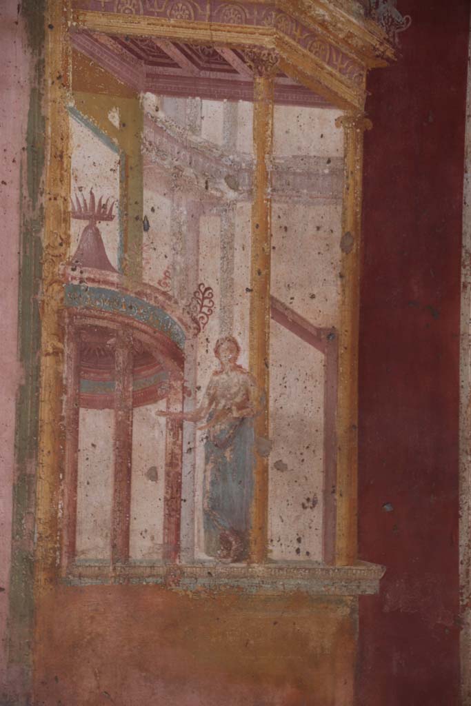 VII.1.47 Pompeii. September 2017.
Exedra 10, detail of muse (Clio or Calliope?) in painted architectural decoration on east side of central painting on north wall.
Photo courtesy of Klaus Heese.