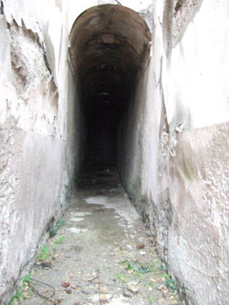 VII.1.48 Pompeii. December 2005. Looking east along corridor K. This leads to apodyterium (changing room) 11 of the women�s baths.