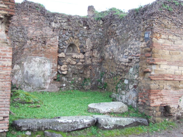 VII.2.12 Pompeii. Shop. December 2007. North wall with staircase.