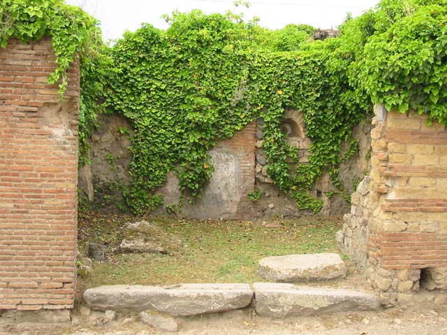 VII.2.12 Pompeii. Shop. December 2007. Terracotta waste pipe from upper floor.