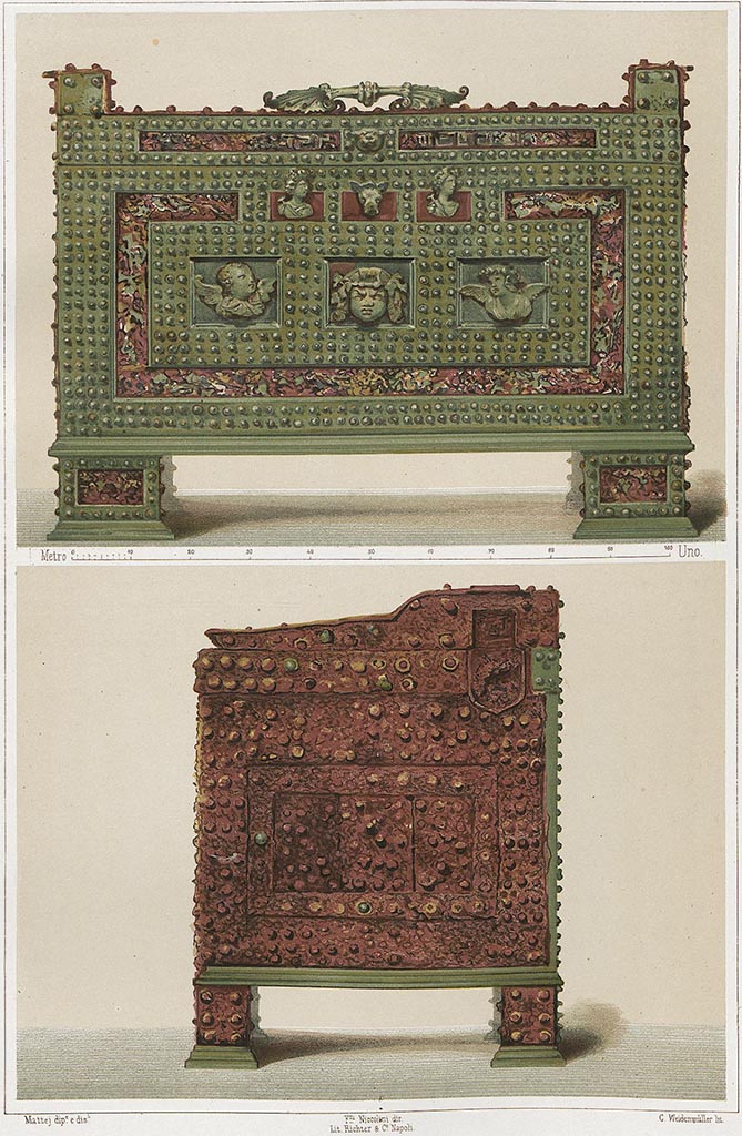 VII.2.18 Pompeii. 
Painting by Niccolini of strong box/money chest, described by Niccolini as being from the house opposite Stabian Baths. 
This would appear to be the same “arca” as found in VIII.4.12.
VIII.4.12 has mention of a strong box found against a wall in the peristyle/garden, and would be opposite the Stabian Baths.
According to Niccolini –
The bronze chest was made of iron covered by bronze, the decorations that adorned this chest were cast and finely chiselled. 
It is now [1862] in the Museo Nazionale in the “salone de’ bronzi”.
See Niccolini F, 1862. Le case ed i monumenti di Pompei: Volume Secondo. Napoli, (Descrizione Generale, tav. XXXIII).
According to Espen B. Andersson [email]: 
The money chest in this colour photo cannot be from VIII.4.12 because, there, the base has an iron hook on the top of the platform.  
This iron hook is not high enough to get into and secure the four legged chest. The legs lift it up too high.  
The actual chest can therefore not belong to this platform. The central iron hook or rod was always to keep a chest firmly fastened. 
Seen against this background VII.2.18 is more likely.  
Our thanks to Espen B. Andersson, for pointing out this information on the cash chest.


