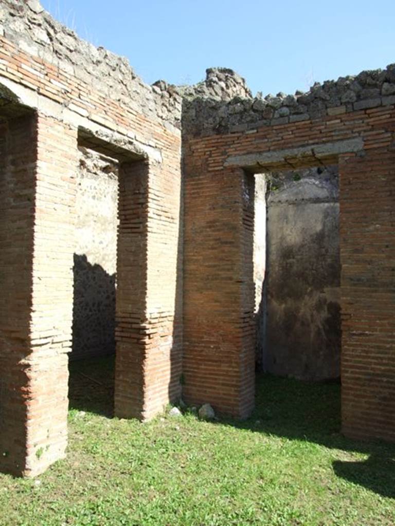 VII.2.18 Pompeii. March 2009. Doorways to Rooms 2 and 3 in north east corner of atrium.