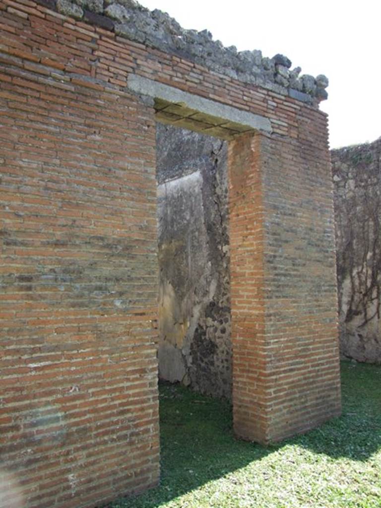 VII.2.18 Pompeii. March 2009. Doorway to room 4, cubiculum.
According to Richardson, in the second cubiculum on the east of the atrium were preserved remains of fine Third Style decoration with two large landscapes of fine quality.
See Richardson, L., 1988. Pompeii: an Architectural History. Baltimore: John Hopkins University Press. (p.312)