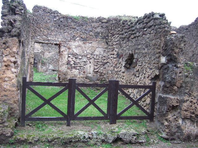 VII.2.49 Pompeii. December 2005. Looking north across shop to doorway in rear wall to atrium of VII.2.48.
