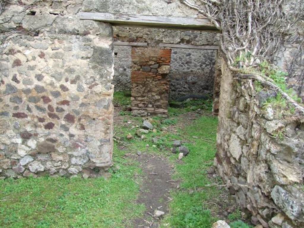 VII.3.4 Pompeii. March 2009. Doorway to Kitchen, in south wall of garden.