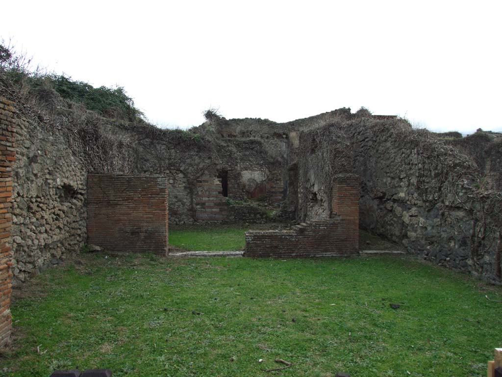 VII.3.8 Pompeii. May 2005. East wall with kitchen and steps to upper floor.