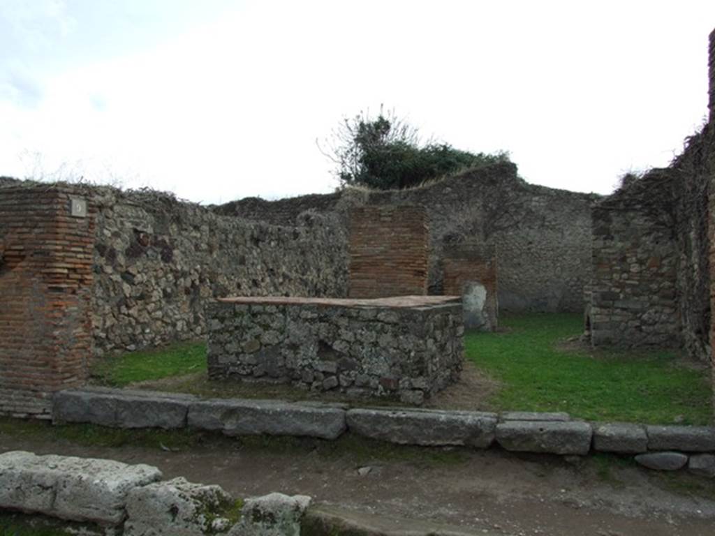VII.3.9 Pompeii.  Popina?  May 2005.  Looking south west towards oven or hearth.