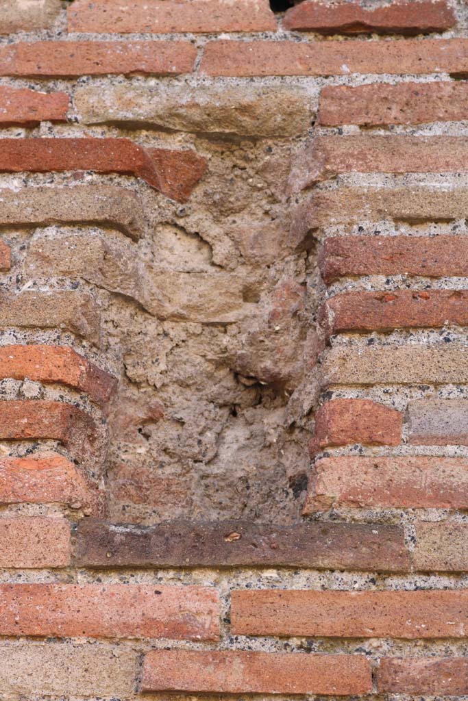 VII.3.23 Pompeii. March 2009. Terracotta and tufa plaque.