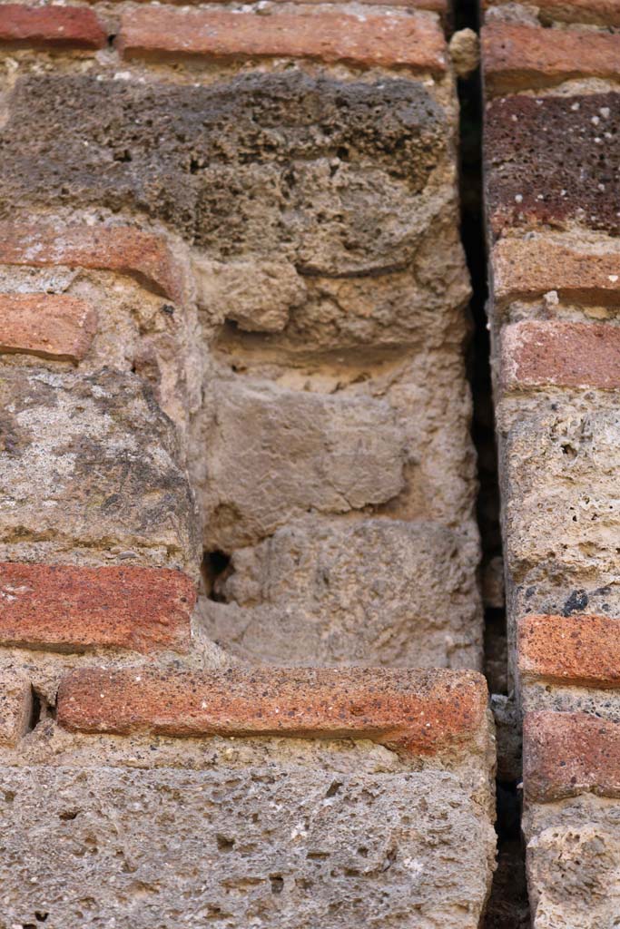 VII.3.23 Pompeii. May 2010. South wall of rear room of shop, with window onto Vicolo del Panettiere.