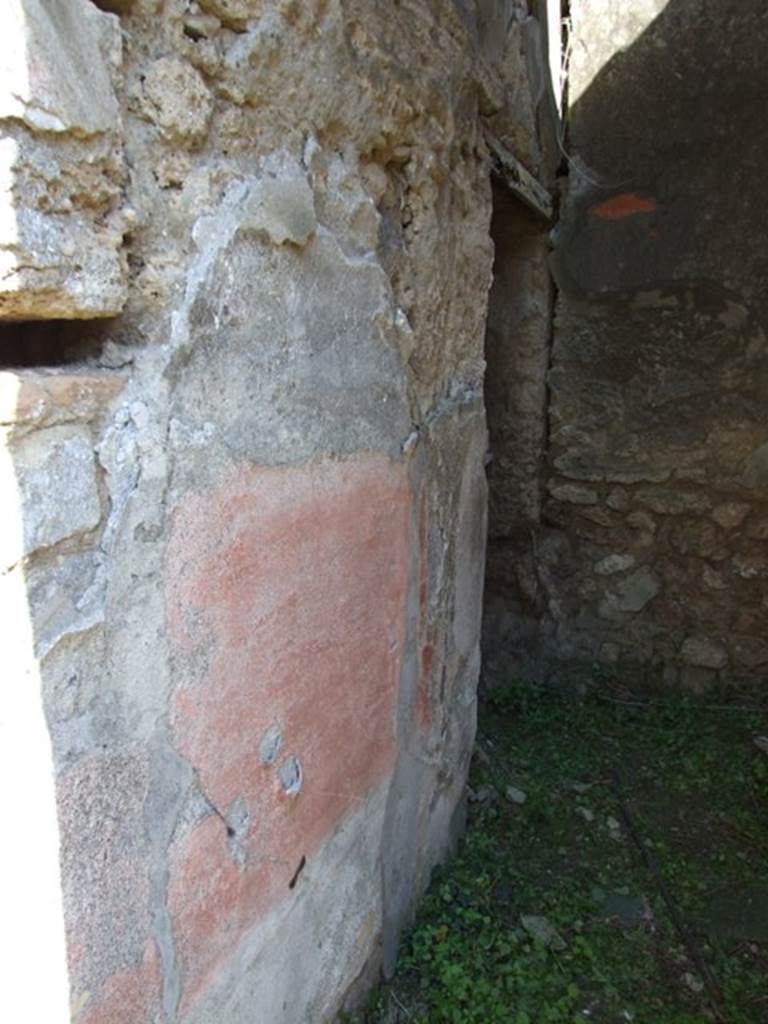 VII.3.29 Pompeii. March 2009. Room 12, north wall of corridor with doorway to garden area (no access). In this area were also an exedra or triclinium, another triclinium with window onto the garden and a niche shrine. According to Richardson, the best rooms of the house were a pair of dining rooms opening onto a small garden. These opened off a small square area that contained the lararium niche. The triclinium opened directly to the garden by  a large window with a low sill and had fine black and red decoration. The decoration was once very fine with large paintings in the centre panels, and delicate architecture in the upper zone.  Only ruins of this now remain but drawings were made of it when it was freshly excavated. Two paintings were taken to Naples Museum, inventory numbers 120085 and 120086. See Sogliano, A., 1879. Le pitture murali campane scoverte negli anni 1867-79. Napoli: (p. 101 no: 548 � 120085, and p.126 no: 616 � 120086)  See Richardson, L., 1988. Pompeii: an Architectural History. Baltimore: John Hopkins University Press. (p. 222-3)
