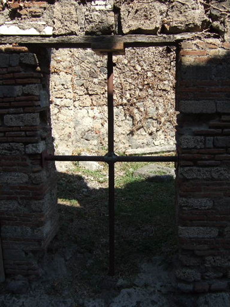 VII.3.35 Pompeii.  December 2007.  Looking south east across VII.3.34 to doorway of VII.3.33 on Vico del Panettiere.
