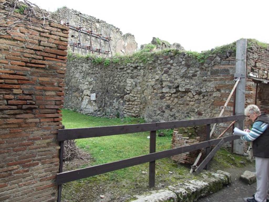 VII.3.37 Pompeii. Shop. December 2007. Looking east along remains of corridor or porticus leading to small garden at rear.
