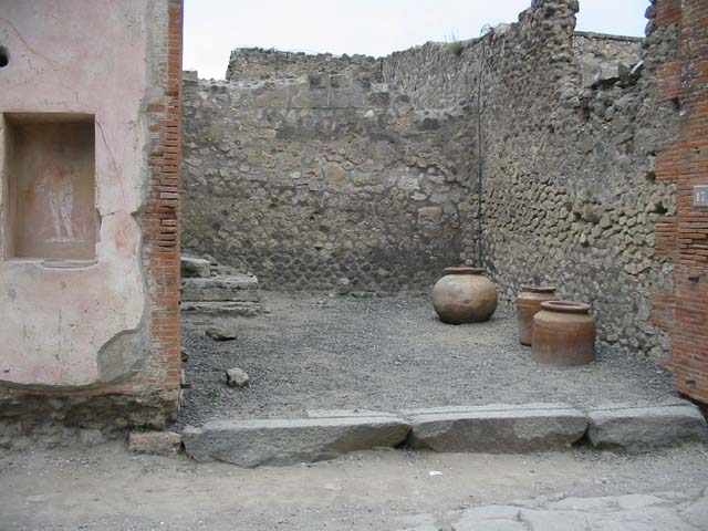 VII.4.17 Pompeii. May 2010. Street shrine with a picture of Jupiter with thunderbolt and sceptre, on left pillar of VII.4.17.
See Fröhlich, T., 1991, Lararien und Fassadenbilder in den Vesuvstädten. Mainz: von Zabern. (F48: p.325).
See Eschebach, L., 1993, Gebäudeverzeichnis und Stadtplan der antiken Stadt Pompeji. Köln: Böhlau. (p.275).
See Boyce G. K., 1937. Corpus of the Lararia of Pompeii. Rome: MAAR 14. (p.111, no. 15)