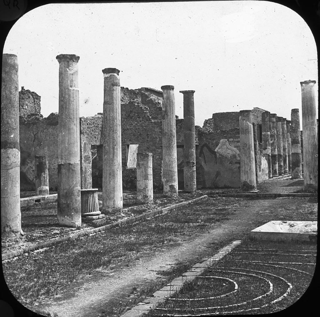 VII.4.31/51 Pompeii.
Looking south-east from the north-west corner towards the east portico of the north peristyle, showing the brick edged flower-bed.
According to Jashemski, the garden area was divided by a shallow square pool (1.15 x 1.15m) with a marble fountain in the centre.
On each side of the pool was an imperfectly preserved planting bed, consisting of bricks set on edge arranged to form four concentric circles within two rectangles.
Only the west half of the bed to the north of the pool is visible today.
See Jashemski, W. F., 1993. The Gardens of Pompeii, Volume II: Appendices. New York: Caratzas. (p.179-80)
Photo by permission of the Institute of Archaeology, University of Oxford. File name instarchbx202im015. Resource ID. 44484.
See photo on University of Oxford HEIR database