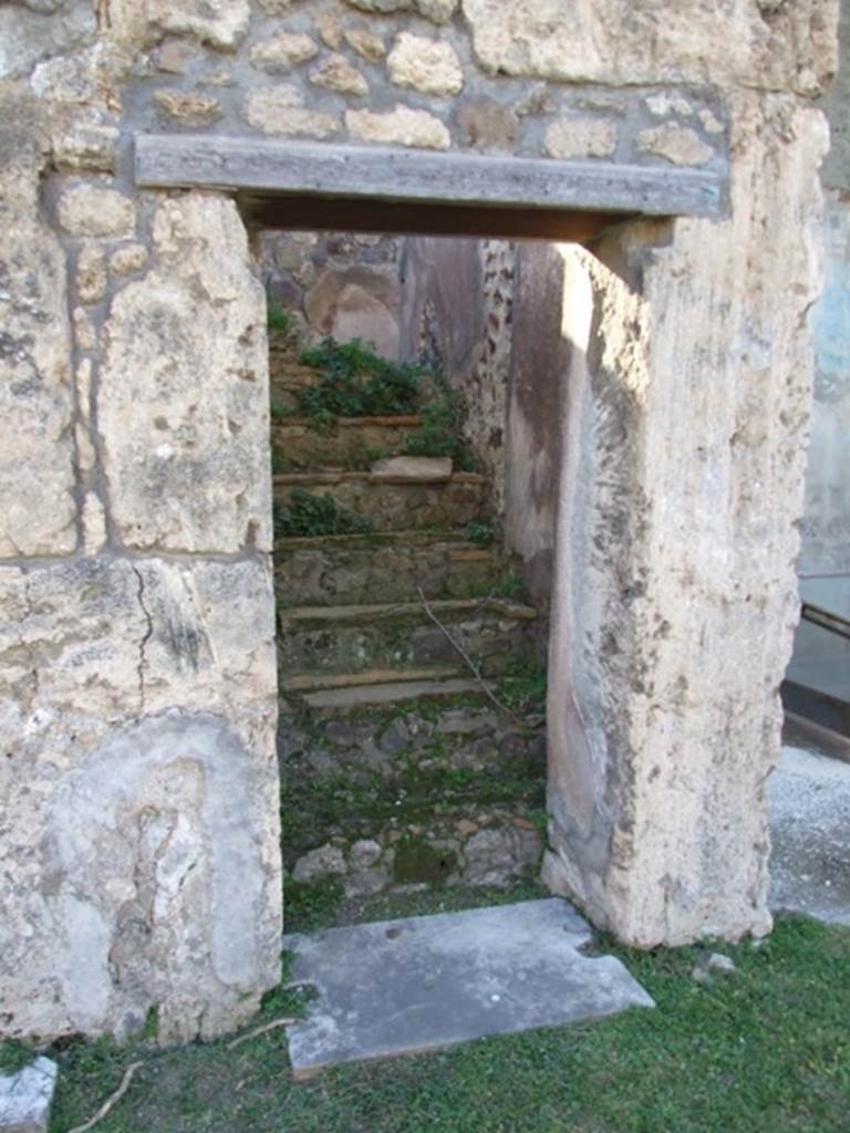 VII.4.31 Pompeii. March 2009. Doorway to Room 17. Steps to upper floor.