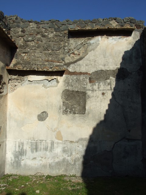 VII.4.31 Pompeii. March 2009. Room 20. Oecus. West wall. The central wall painting was removed to Naples Museum. It showed Ariadne being discovered by Dionysus on the island of Naxos. (Inventory number 9278).