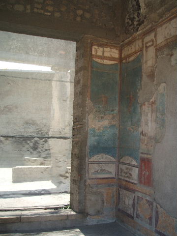 VII.4.48 Pompeii. December 2007. Room 11.  Detail from West wall of Tablinum.
