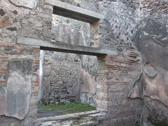 VII.4.48 Pompeii. December 2007. Room 13, ala. Detail of wall painting on upper west wall, Mercurius with caduceus, hat and winged sandals.
