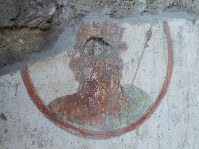 VII.4.48 Pompeii.  March 2009. Room 2.  Atrium. North wall, east side of entrance. Remains of painted plaster.